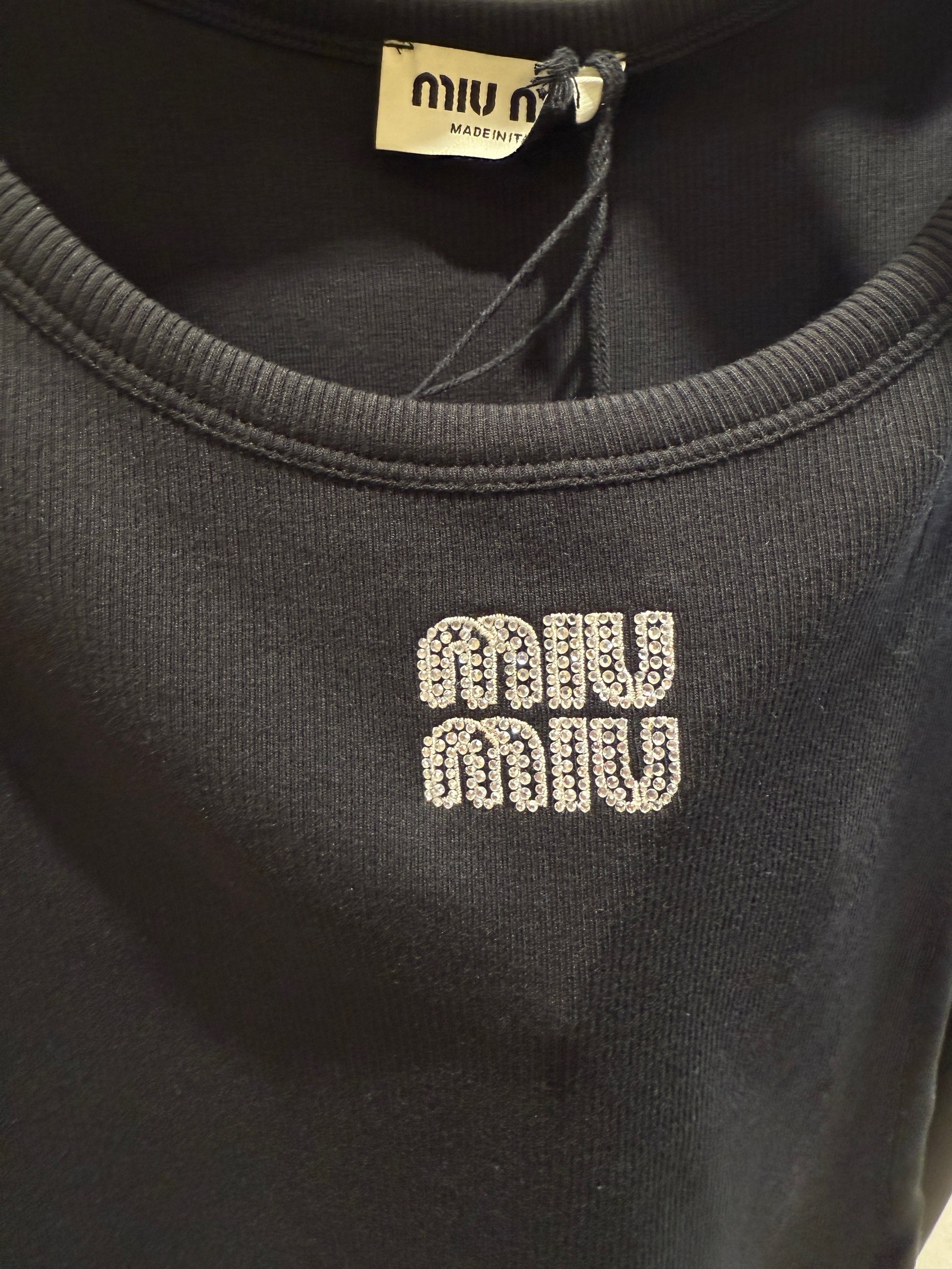 MM black tank top with strace logo