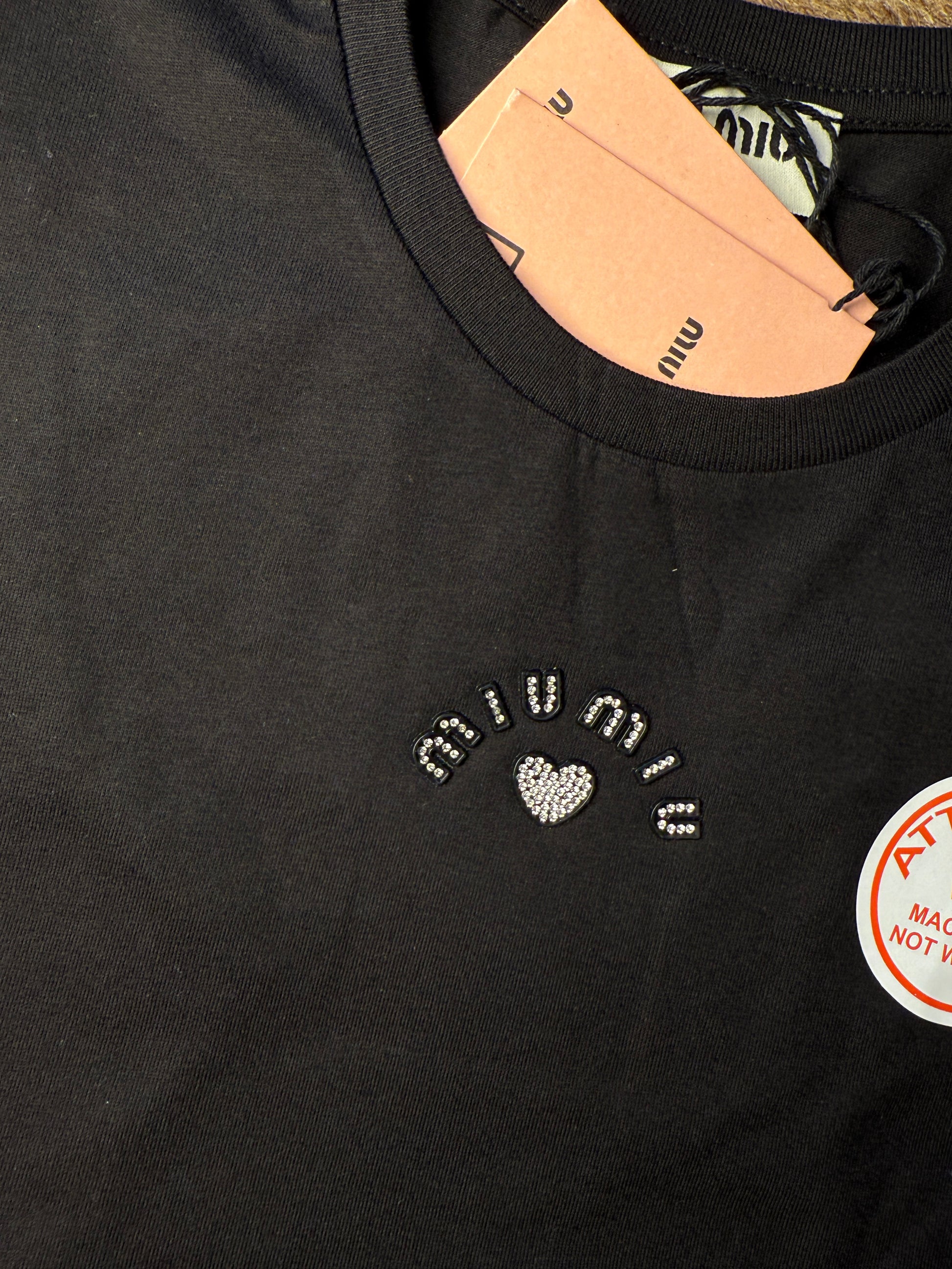 MM black shirt logo strace