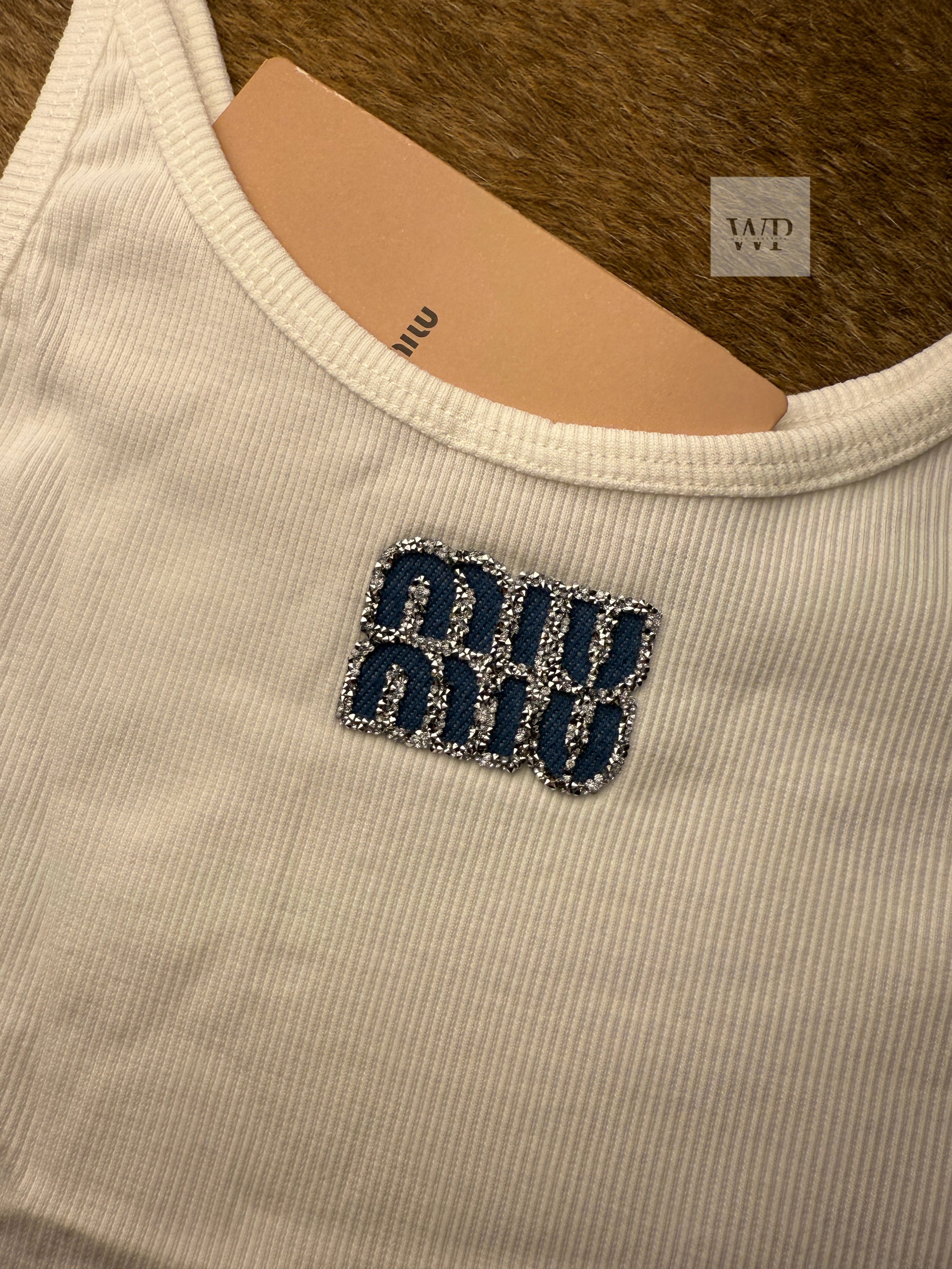 White tank top with blue strace
