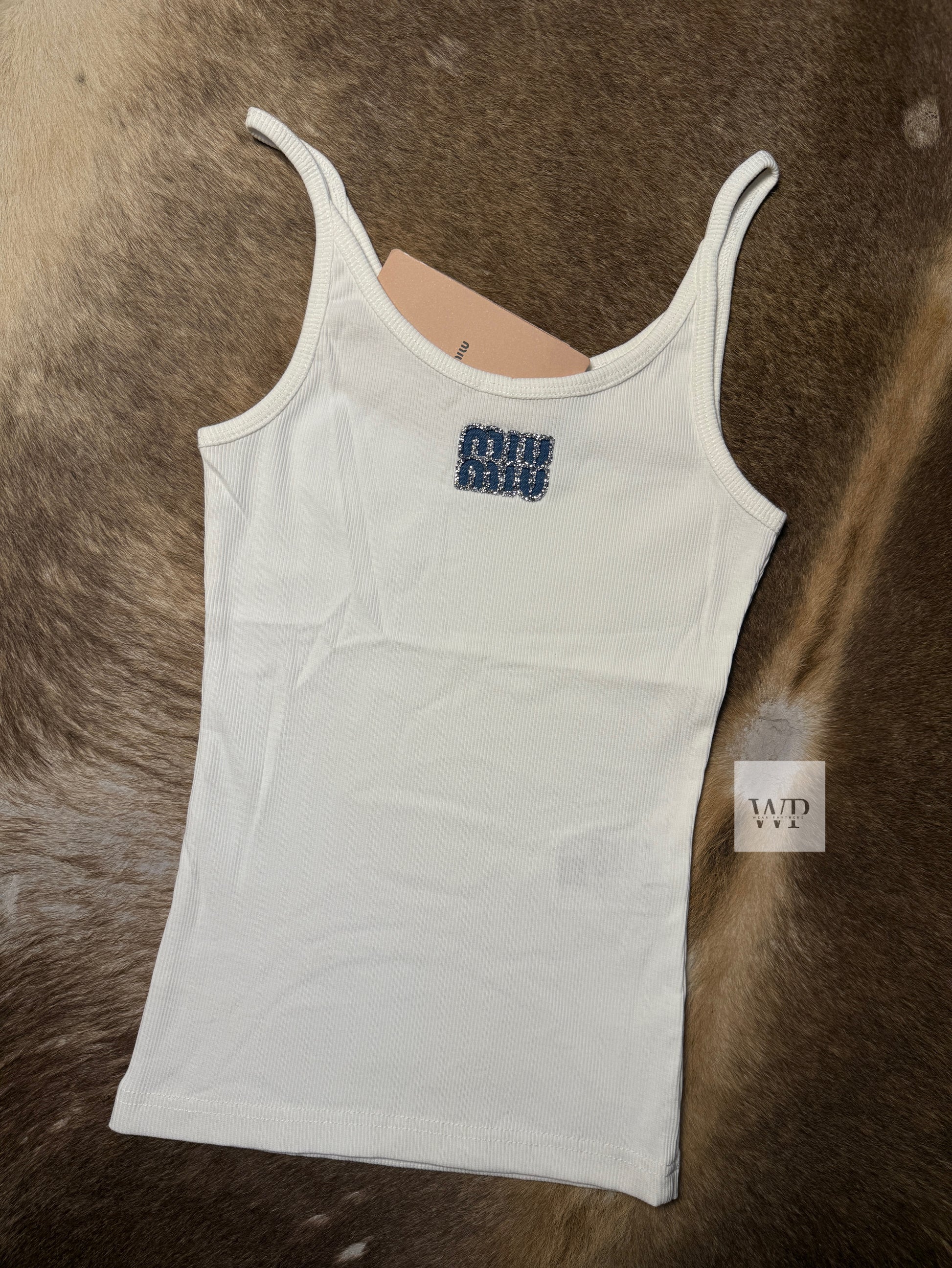 White tank top with blue strace